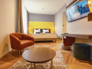 Comfort Zimmer mit Lounge-Sessel